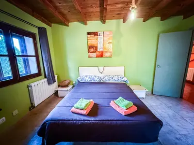 a bedroom with a bed with two pillows on it at La Casa del Monte in Ocero