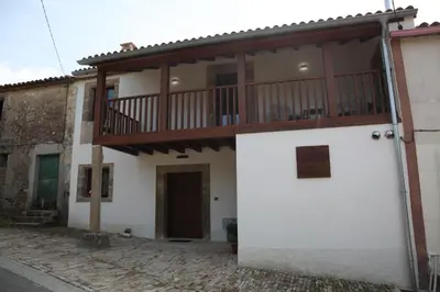a house with a balcony on top of it at Casa GHOROS in Boente