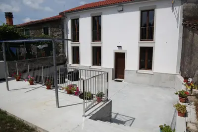 a courtyard of a house with potted plants at Casa GHOROS in Boente