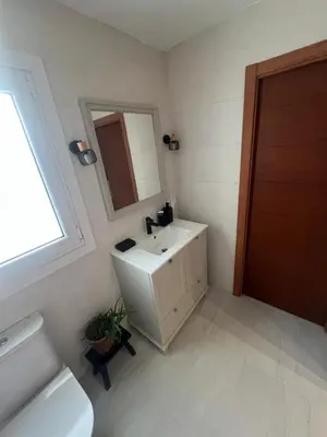 a white bathroom with a sink and a mirror at EnGaliciaEs - Casa alquiler turistico en ingles!