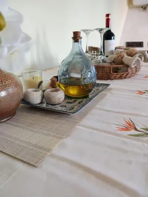 a table with a bottle of oil and some mushrooms at EnGaliciaEs - Casa alquiler turistico en ingles!