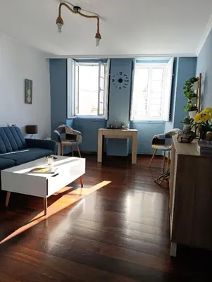 a living room with a couch and a coffee table at Kilómetro99 in Lugo