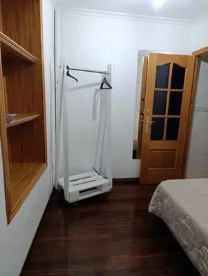 a room with a glass shower in the corner of a room at Kilómetro99 in Lugo