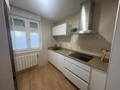 a kitchen with a sink and a counter top at El pisito de Cris y Mia in Ponferrada
