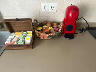 a table with a box of eggs and a red blender at El pisito de Cris y Mia in Ponferrada