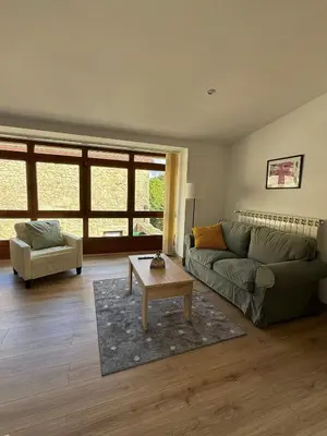 a living room with a couch and a coffee table at A Casa do Veterinario in Sales