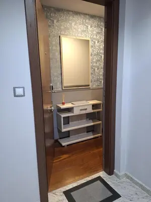 a bathroom with a sink and a mirror on a wall at Apartamento Centro Calle Reina in Lugo