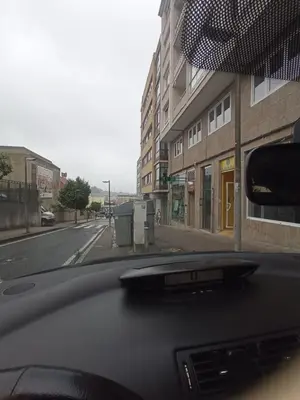 a view of a street from a car windshield at habitación mestre 1 in Santiago de Compostela