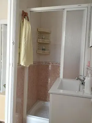 a bathroom with a shower and a sink at Casa Belén in Burela de Cabo
