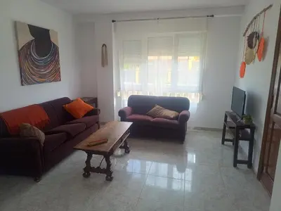 a living room with two couches and a coffee table at Casa do Pina in Villarmayor