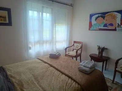 a bedroom with a bed with two towels on it at Casa do Pina in Villarmayor