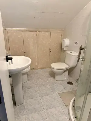 a bathroom with a toilet and a sink at Meson el Acebo in El Acebo de San Miguel