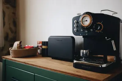 a counter with a coffee maker and a clock on it at Casa da Edrada