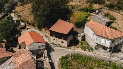 an aerial view of an old house and a building at Casa da Edrada
