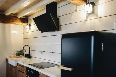 a kitchen with a sink and a counter top at Casa da Edrada