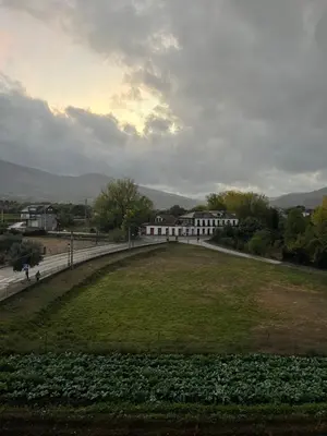 a large grassy field in front of a building at Pensión Ferreiriño in Quiroga