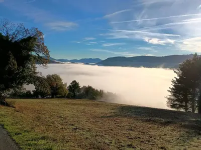 a view of a field with fog in the valley at Hotel Rural El Nuevo Semellon Aceptamos Mascotas in La Llama