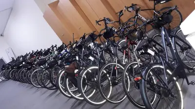 a row of bikes parked next to each other at Albergue Ferramenteiro in Portomarin