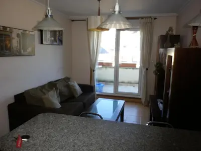 a living room with a couch and a table at Ático a 5 minutos de TODO Mariña Lucense in Viveiro