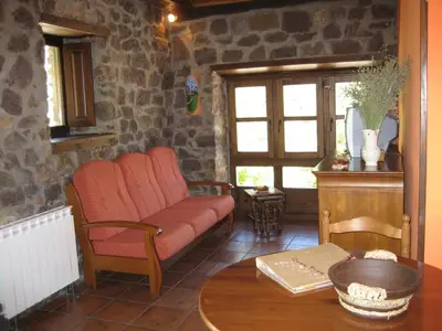 a living room with a couch and a table at Casa Pipa in Pola de Somiedo