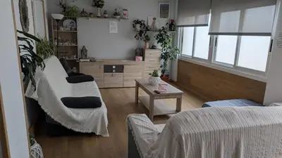a living room with a couch and a table at Apartamento Camiño Real 2 - A Casa de María 2ª Planta in Sigüeiro