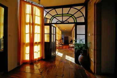 a hallway with a door open to a living room at Casa Grande De Trives in Puebla de Trives