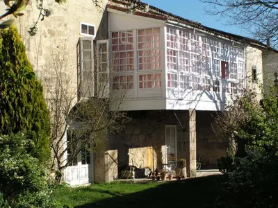 a building with a window on the side of it at Casa Grande De Trives in Puebla de Trives