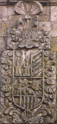 a carving on the side of a building at Casa Grande De Trives in Puebla de Trives