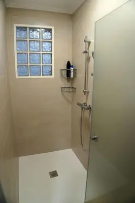 a bathroom with a shower with a glass door at Casa Ribeira Sacra in Chantada