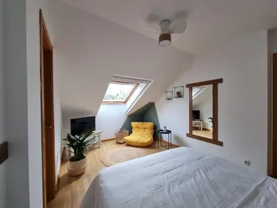 a bedroom with a bed and a window and a mirror at Vila, 132 - II in San Cosme de Barreiros