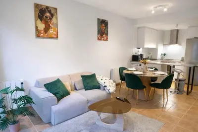 a living room with a couch and a table at Apartamento en Ares a 400 m de la playa con jardín privado in Ares