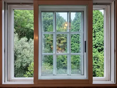 a window in a room looking out at trees at Oasis Ponte San Lázaro in Santiago de Compostela