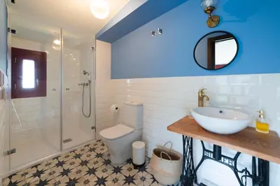 a bathroom with a sink and a toilet and a shower at Casa do Mao in San Lorenzo de Barjacoba