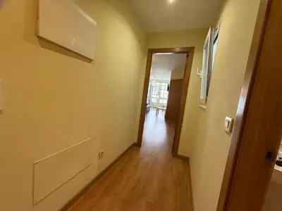 an empty room with a hallway leading to a door at S 64 Vut in Lugo