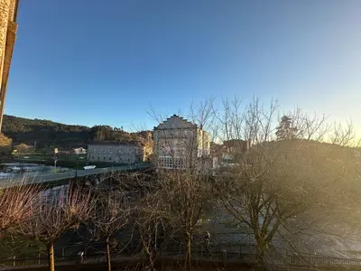 a view of a city with buildings and trees at Pensión Villa Mayer - Grupo Arcanos in Caldas de Reis