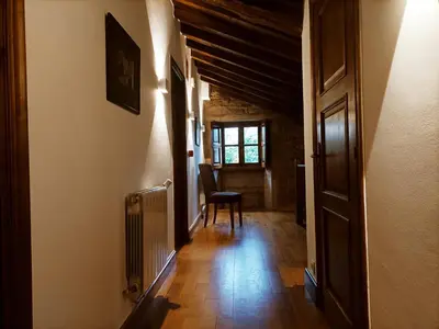 a staircase in a house with a light on the wall at Vila As Pedras in Roxos