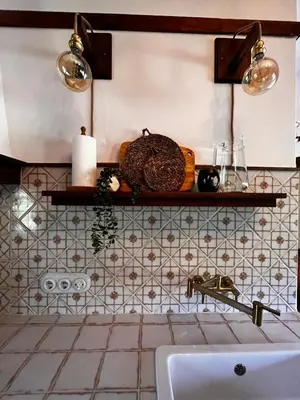 a kitchen counter with a sink and a shelf at A Maquía de Medín in O Pino