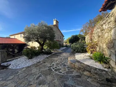 a cobblestone street in front of a building at Casa Rural Val Fresco - Casa Piano in Curantes