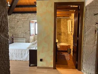 an open doorway to a bedroom with a bed at Casa Rural Val Fresco - Casa Piano in Curantes