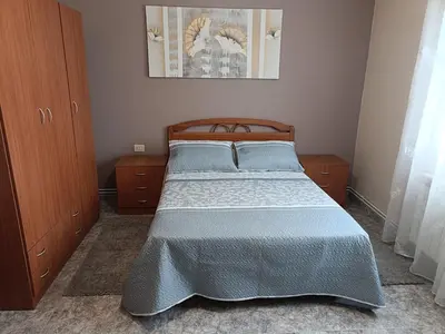 a bedroom with a large bed with blue pillows at Casa Castro in A Estrada