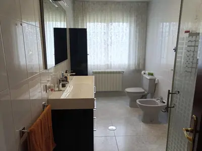 a bathroom with a sink and a toilet at Casa Castro in A Estrada