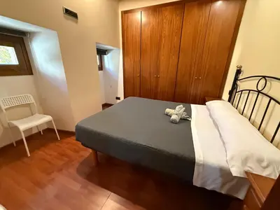 a bedroom with a bed with a stuffed animal on it at M 29 vut in Lugo