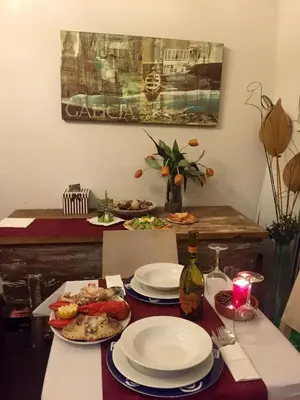 a table with plates of food on top of it at Casa Garea in Arzúa