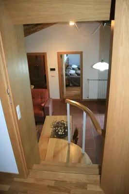 a stairway leading to a living room and a bedroom at Casa Garea in Arzúa