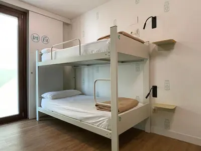 a bunk bed room with two bunk beds at Albergue Guiana in Ponferrada