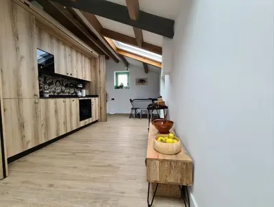 a hallway with a table with a bowl of fruit on it at El Sueño in Barres