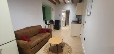 a living room with a couch and a table at El Sueño in Barres