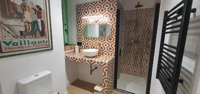 a bathroom with a sink and a mirror on a table at El Sueño in Barres