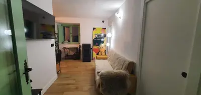 a hallway leading to a living room with a couch at El Sueño in Barres
