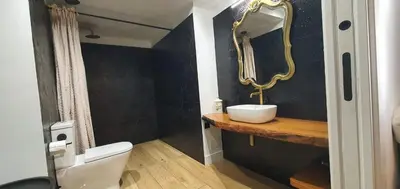a bathroom with a sink and a mirror at El Sueño in Barres